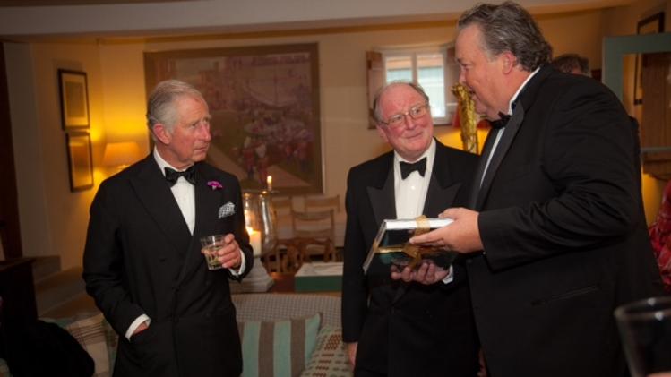 In this courtesy photo provided by the Hereford Cathedral Perpetual Trust, from left, England's Prince Charles, Christopher James, Chairman of Hereford Perpetual Trust, and Joel A. Bartsch, President of the Houston Museum of Natural Science gather for a black-tie dinner at Prince Charles' country estate in Wales, Llwynywermod, where a partnership was discussed to bring one of the four 1217 Magna Cartas to the Houston Museum of Natural Science for viewing. The British archive that holds the document says the trip might be the first time it has left Hereford, England, since it was issued. (AP Photo/Huw Evans Picture Agency, Gareth Everett)